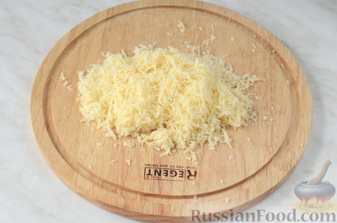 Фото приготовления рецепта: Цветная капуста в чесночном соусе, запечённая под сыром - шаг №13