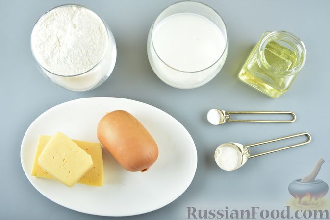 Фото приготовления рецепта: Ленивые "пирожки" на кефире, с сыром и сардельками - шаг №1