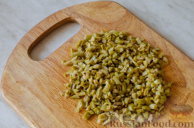 Фото приготовления рецепта: Картофель с оливками, запечённый в сливках - шаг №6