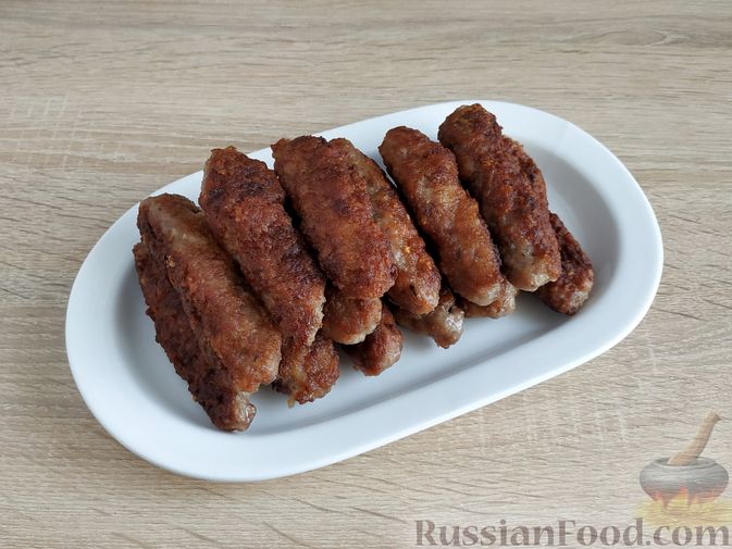 Фото приготовления рецепта: Мититеи (молдавские колбаски из мясного фарша) - шаг №10