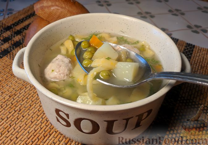 Фото приготовления рецепта: Суп с фрикадельками, морковной лапшой и горошком - шаг №26