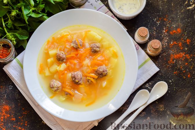 Фото приготовления рецепта: Суп с фрикадельками, картофелем и капустой - шаг №14
