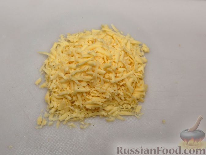 Фото приготовления рецепта: Картошка, запечённая с цветной капустой, сливками и сыром - шаг №6