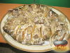 Фото к рецепту: Лещ запечённый с грибами в сметане