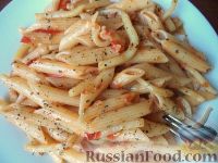 Фото к рецепту: Паста с кальмарами и помидорами