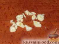 Фото приготовления рецепта: Кальмары со сметаной и чесноком - шаг №4