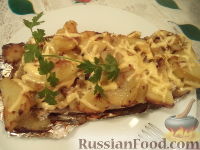 Фото к рецепту: Скумбрия запеченная, фаршированная картофелем