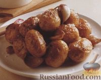 Фото к рецепту: Картофель, печеный с чесноком