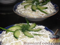 Фото к рецепту: Салат с капустой и шпротами