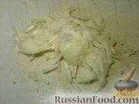 Фото приготовления рецепта: Кальмары, тушенные в сметане - шаг №5