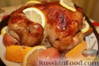 Фото к рецепту: Курица, запеченная с яблоками и апельсинами