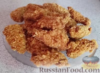 Фото приготовления рецепта: Жареная курица с хрустящей корочкой - шаг №7