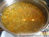 Фото приготовления рецепта: Суп с колбасой и рисом - шаг №9