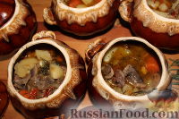 Фото приготовления рецепта: Куриные сердечки с овощами и грибами (в горшочке) - шаг №14