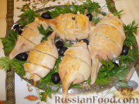Фото к рецепту: Кальмары, фаршированные рисом и овощами