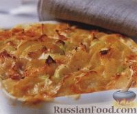 Фото к рецепту: Картофель, запеченный с луком пореем и сыром