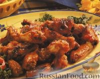 Фото к рецепту: Куриные крылышки под медовым соусом