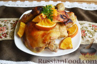 Фото к рецепту: Курица, запеченная с апельсинами