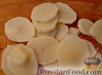Фото приготовления рецепта: Треска, запеченная с картофелем и овощами - шаг №6