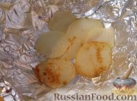 Фото приготовления рецепта: Треска, запеченная с картофелем и овощами - шаг №9