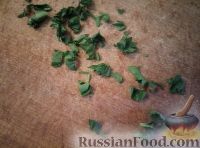 Фото приготовления рецепта: Кальмары со сметаной и зеленью - шаг №7