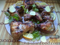 Фото к рецепту: Куриные крылышки, жаренные на решетке