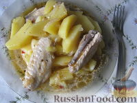 Фото к рецепту: Жаркое из куриных крылышек с картофелем