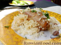 Фото к рецепту: Кролик тушеный с рисом