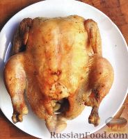 Фото к рецепту: Курица, запеченная с чесноком и лимоном