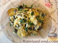 Фото к рецепту: Картофель, запеченный в духовке с сыром и грибами