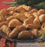 Фото к рецепту: Пирожки из слоеного теста с куриным мясом