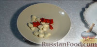 Фото приготовления рецепта: Острый соус из слив (на зиму) - шаг №6