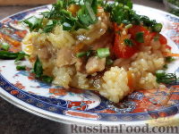 Фото к рецепту: Куриные бедрышки с карри, тушенные с рисом и овощами