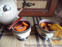 Фото приготовления рецепта: Апельсиновый глинтвейн с корицей - шаг №6