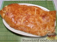 Фото к рецепту: Рыбный пирог из слоеного теста