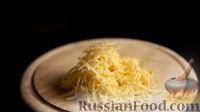 Фото приготовления рецепта: Минтай, запеченный в духовке под сырным соусом - шаг №6