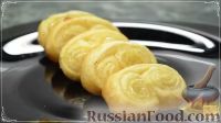 Фото приготовления рецепта: Домашнее печенье "Ушки" из слоеного теста - шаг №9