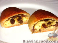 Фото к рецепту: Пирожки печеные с творогом и изюмом