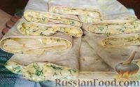 Фото к рецепту: Закуска из лаваша с сыром, зеленью и чесноком
