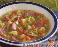 Фото к рецепту: Капустный суп с копчеными колбасками и яблоками