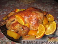 Фото к рецепту: Курица, запечённая с апельсинами и тыквой