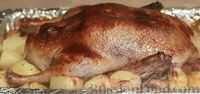 Фото приготовления рецепта: Фаршированная утка с хрустящей корочкой, в духовке - шаг №14
