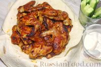 Фото к рецепту: Крылышки, запечённые в соусе с острым кетчупом и мёдом
