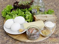 Фото приготовления рецепта: Салат с анчоусами, яйцами и сухариками - шаг №1