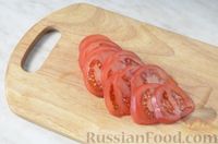 Фото приготовления рецепта: Минтай, запечённый с помидорами и сыром - шаг №4