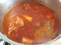 Фото приготовления рецепта: Тушёная рыба в томатном соусе - шаг №10