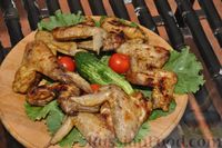 Фото приготовления рецепта: Куриные крылышки в медовом маринаде (на мангале) - шаг №11