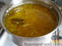 Фото приготовления рецепта: Суп с фрикадельками и рисом - шаг №11