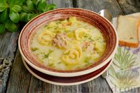 Фото к рецепту: Куриный суп с рулетиками из яичного теста с плавленым сыром
