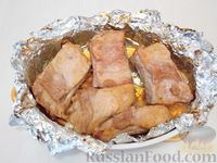 Фото приготовления рецепта: Запечённые свиные ребрышки в томатном маринаде - шаг №10